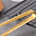Accessoire de table : pinces à sucre dorées
